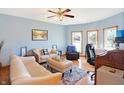 Comfortable living room with hardwood floors, natural light, and a ceiling fan at 186 W 600 N, Alexandria, IN 46001
