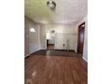 Inviting living room showcasing hardwood flooring, fresh neutral paint, and views of the kitchen at 3646 Creston Dr, Indianapolis, IN 46222