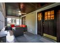 Inviting porch with comfortable seating, ceiling fan, and views of the neighborhood at 3918 N Park Ave, Indianapolis, IN 46205