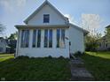 Charming home featuring a quaint front yard and multiple windows at 421 N Canal St, Alexandria, IN 46001