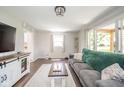 Cozy living room with hardwood floors, neutral paint, and lots of natural light at 433 N 15Th Ave, Beech Grove, IN 46107