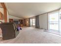 Cozy living room featuring plush carpeting and lots of natural light at 4641 Autumn Ridge Dr, Columbus, IN 47203