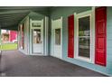 Covered porch featuring classic design elements and red shutters for added charm and curb appeal at 538 N East St, Greenfield, IN 46140