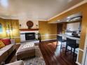 Bright living space featuring a fireplace, eat-in kitchen, and stylish furniture at 5433 Brendonridge Rd, Indianapolis, IN 46226