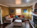Comfortable living space with a fireplace, stylish decor, and a cozy sectional sofa at 5433 Brendonridge Rd, Indianapolis, IN 46226