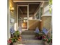 Charming front porch featuring brick supports and accents, room for seating and decor, and a storm door at 5622 Guilford Ave, Indianapolis, IN 46220