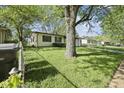 A view of the side yard with a partial view of the house at 611 Hampton Ln, Anderson, IN 46017