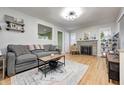 Inviting living room with a stone fireplace, hardwood floors, and stylish decor at 752 N Leland Ave, Indianapolis, IN 46219
