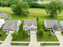 An aerial view of a well maintained home with a long driveway and beautiful lawn at 7559 Pipestone Dr, Indianapolis, IN 46217