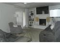 Bright and open living room featuring a fireplace, built-in shelving, and comfortable seating at 833 N 700 W, Greenfield, IN 46140
