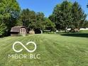 Well-maintained backyard featuring a storage shed and plenty of green space at 8835 Winding Ridge Rd, Indianapolis, IN 46217