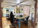 Eclectic dining room with unique wallpaper and a view into the adjacent kitchen at 909 Sullivan St, Alexandria, IN 46001