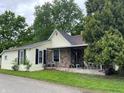 Charming home with a stone-accented porch, complimented by mature trees in a pleasant neighborhood at 121 W Fordice St, Lebanon, IN 46052