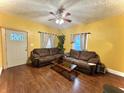 Comfortable living room with hardwood floors and large sofas, perfect for relaxing at 1332 W 26Th St, Indianapolis, IN 46208