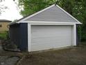 Spacious detached garage with ample parking space, and blue and gray exterior at 3644 N Parker Ave, Indianapolis, IN 46218