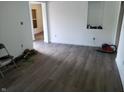 Living room area featuring new floors, fresh white walls, and a recessed display area at 3644 N Parker Ave, Indianapolis, IN 46218