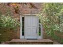 Inviting front entrance with brick archway and well-maintained landscaping at 38 Hawthorne Ct, Carmel, IN 46033