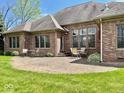 Backyard brick patio is perfect for entertaining or relaxing outdoors at 5200 W Shoreline Ter, Muncie, IN 47304