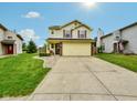 Charming two-story home features a well-manicured lawn, brick accents, and an attached two-car garage at 5361 Cradle River Ct, Indianapolis, IN 46221