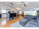 Spacious living room featuring hardwood floors, a comfortable couch, and plenty of natural light at 560 Old Farm Rd, Danville, IN 46122