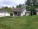 Charming single story home with a brick facade, attached garage, and a well-maintained lawn at 6723 S New Jersey St, Indianapolis, IN 46227