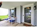Inviting front porch with seating area and charming decor at 6809 Amber Springs Way, Indianapolis, IN 46237