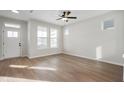 Spacious living room featuring hardwood floors, neutral walls, and lots of natural light from many windows at 786 James William Ln, Westfield, IN 46074