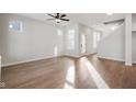 Bright and spacious living room with hardwood floors and large windows allowing plenty of natural light at 786 James William Ln, Westfield, IN 46074