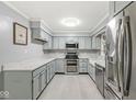 Spacious kitchen featuring modern appliances, ample countertop space, and updated cabinets at 12388 Camberley Ln, Carmel, IN 46033