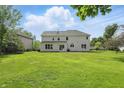 Expansive backyard featuring a lush green lawn, perfect for outdoor activities and relaxation at 12409 Dellfield W Blvd, Carmel, IN 46033