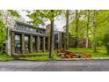 Beautiful home featuring stone accents, large windows, and lush landscaping offering great curb appeal in a serene environment at 12469 Springmill Rd, Carmel, IN 46032