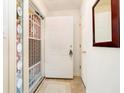 Bright entry foyer with tile flooring, decorative door and a view into the house at 194 Waterford Ct, Avon, IN 46123