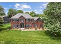 Beautiful red brick home with blue shutters and professionally landscaped lawn at 248 Runyon Ct, Greenwood, IN 46142
