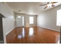 Bright living room with wood floors, neutral paint and ceiling fan at 3059 Black Forest Ln, Indianapolis, IN 46239