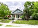 Quaint bungalow with a well-kept yard and cozy front entry at 309 N Riley Ave, Indianapolis, IN 46201