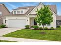 Pleasant home with a tidy front lawn, an attached garage, and a welcoming entrance at 4367 Homestead Dr, Whitestown, IN 46075