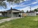 Charming home with a carport and detached garage, offering ample parking and storage space at 453 Illinois St, Fortville, IN 46040