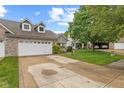 Charming home with green lawn and driveway at 4907 Franklin Villas Pl, Indianapolis, IN 46237