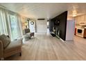 Bright living room showcasing wood floors, neutral paint colors, and lots of natural light at 539 Willow Dr, Danville, IN 46122
