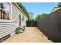 The side patio area features potted plants and access to the home at 6176 Kingsley Dr, Indianapolis, IN 46220