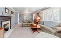 Cozy living room featuring a fireplace and neutral decor at 7135 Huntington Rd, Indianapolis, IN 46240