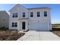 Charming two-story home features a two-car garage and a classic light gray exterior at 7329 Waylon Way, Indianapolis, IN 46239