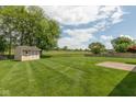 Spacious backyard with well-maintained lawn and storage shed, perfect for outdoor enjoyment at 897 N Scott Dr, Greenwood, IN 46142