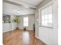 Bright living room featuring hardwood floors, neutral paint, and lots of natural light at 10763 Zimmerman Ln, Indianapolis, IN 46231