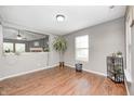 Bright living room featuring hardwood floors, neutral paint, and lots of natural light at 10763 Zimmerman Ln, Indianapolis, IN 46231