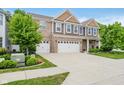 Two-story home with brick and siding, complemented by a well-maintained lawn and a spacious driveway at 1274 Timber Bluff Rd, Westfield, IN 46074
