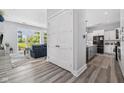 Modern interior with hardwood floors leading to living room and kitchen at 15 W Executive Dr # 101, Carmel, IN 46032