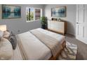 Cozy bedroom with a dresser, a large bed, and decor that creates a peaceful environment at 1726 Creekside W Ln, Carmel, IN 46032