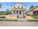 Charming two-story home featuring a covered front porch and modern curb appeal at 1825 E Maryland St, Indianapolis, IN 46201