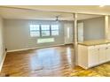 Open-concept living room with hardwood floors, neutral walls, and ample natural light at 1927 E 125 S, Franklin, IN 46131